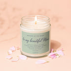 Lit candle in a jar with a "Mother of the Bride To My Beautiful Mum" label.