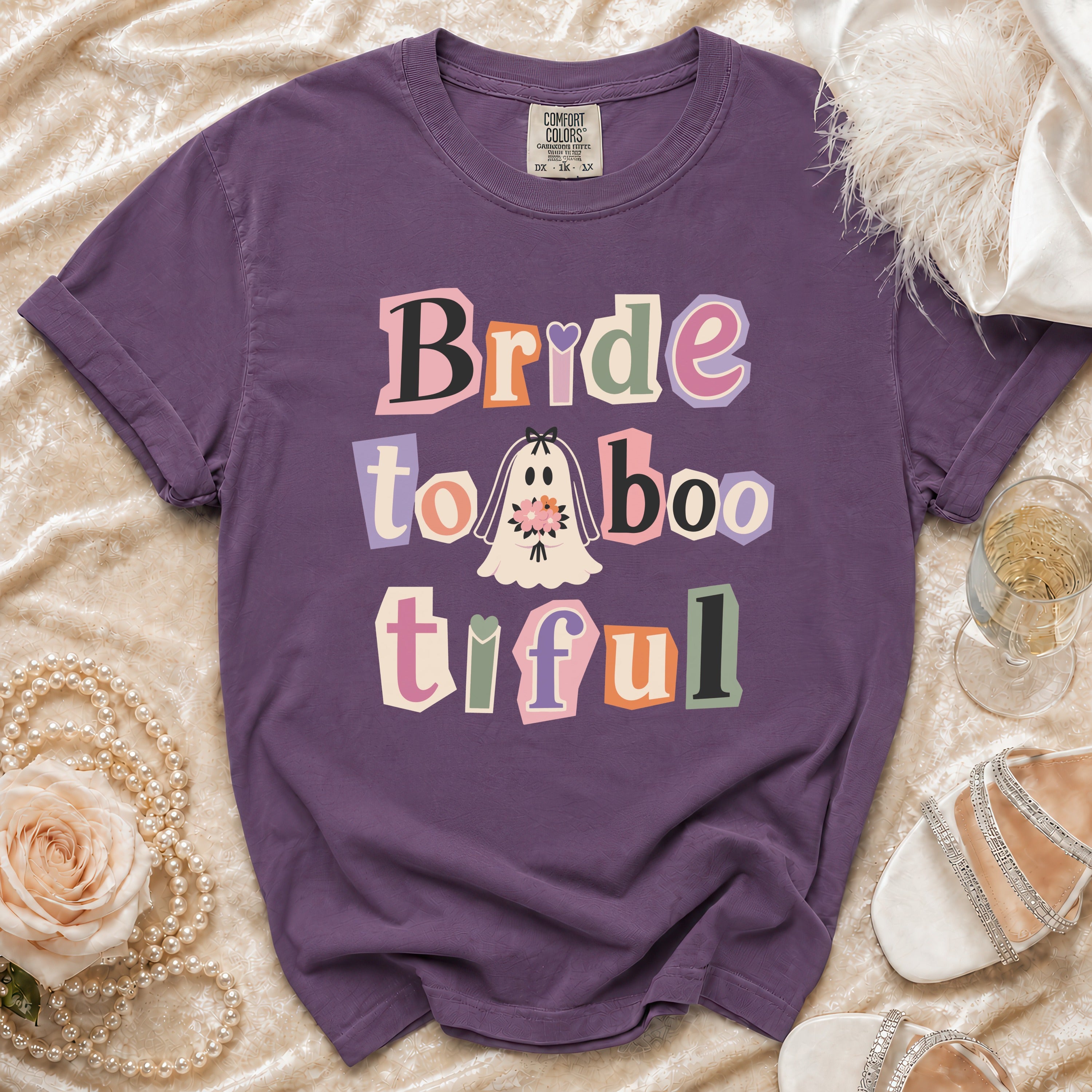 Purple t-shirt with "Bride to Boo-tiful" text and ghost graphic.