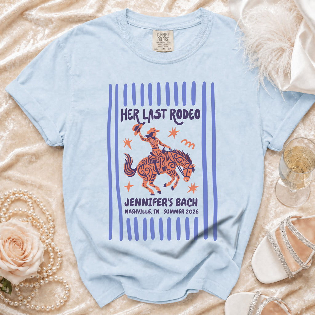 Light blue t-shirt with "Her Last Rodeo" graphic and Nashville bachelorette text.
