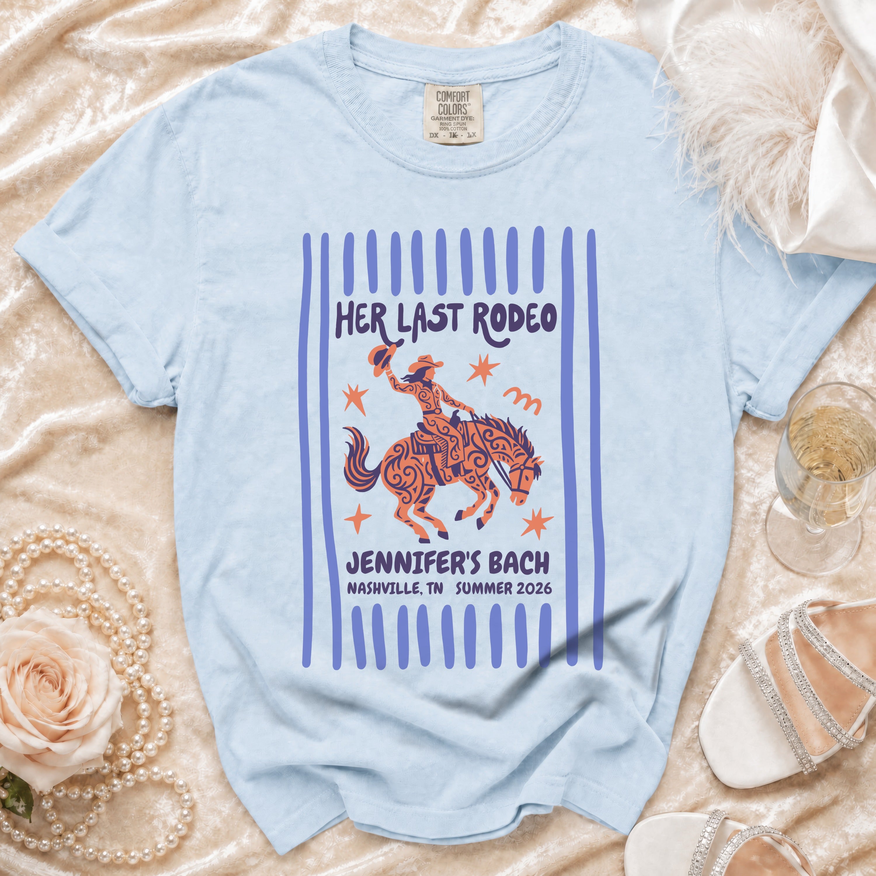 Light blue t-shirt with "Her Last Rodeo" graphic and Nashville bachelorette text.