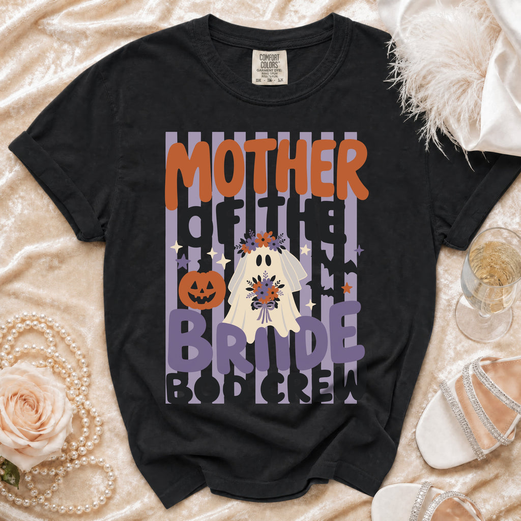 A black t-shirt featuring a Halloween ghost bride graphic with text reading Mother of the Bride Boo Crew.