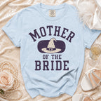 Light blue t-shirt with "Mother of the Bride" and witch hat graphic.