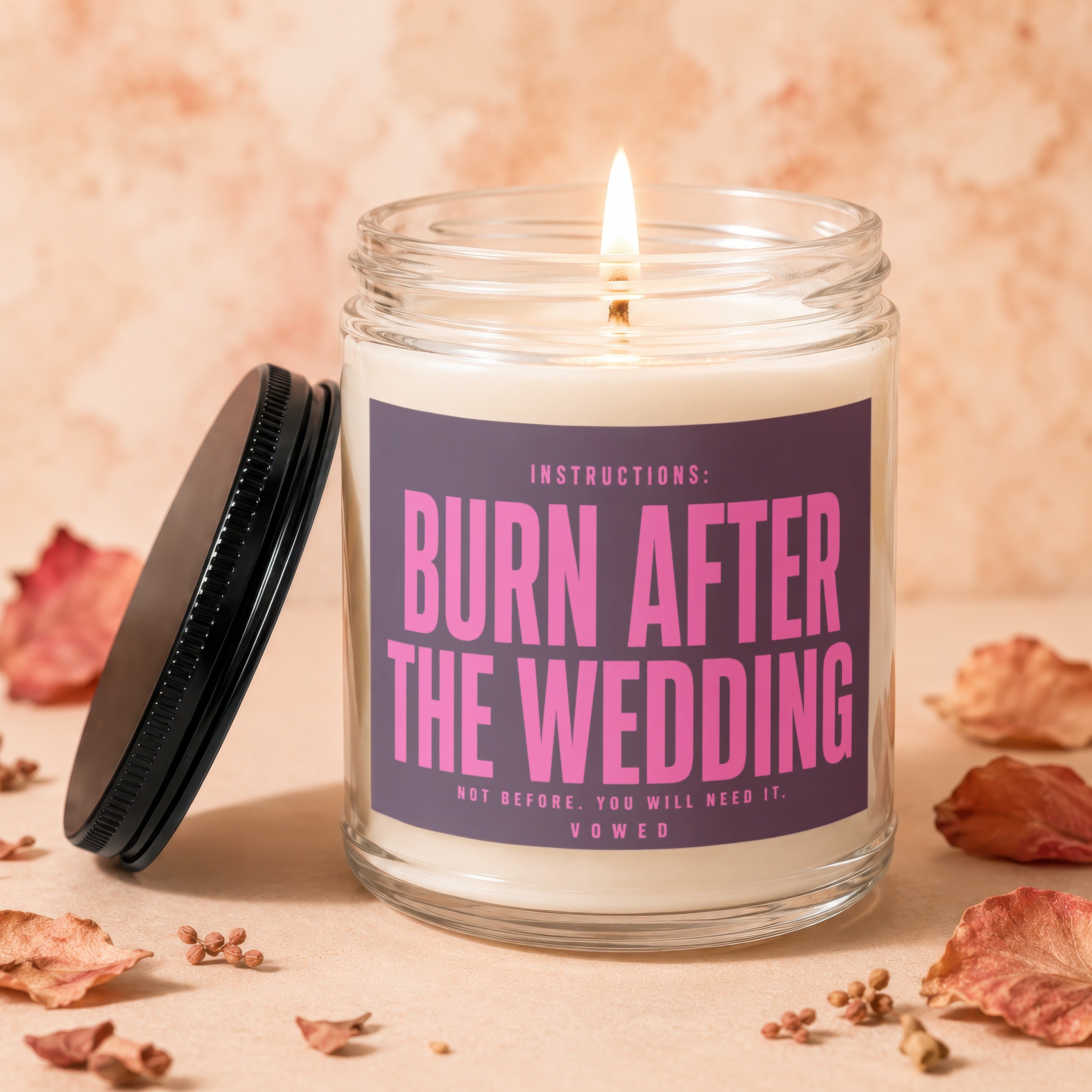 Candle with "Burn After The Wedding" inscription on label.