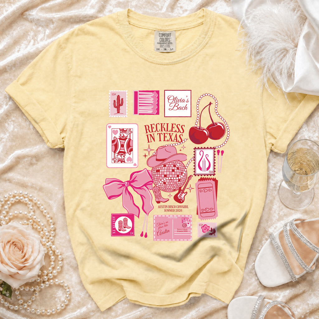 Yellow t-shirt with "Olivia's Bach" and "Reckless in Texas" graphic.