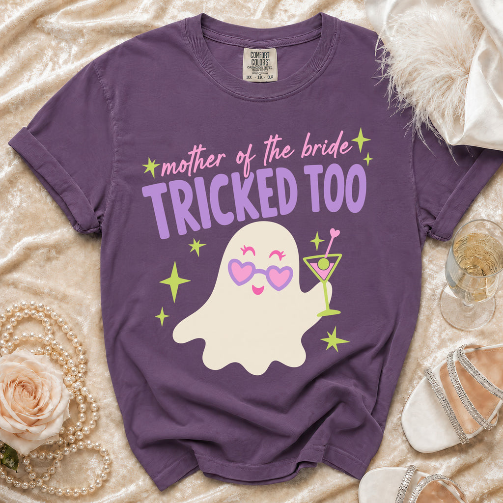 Purple t-shirt with "mother of the bride TRICKED TOO" and a ghost design.