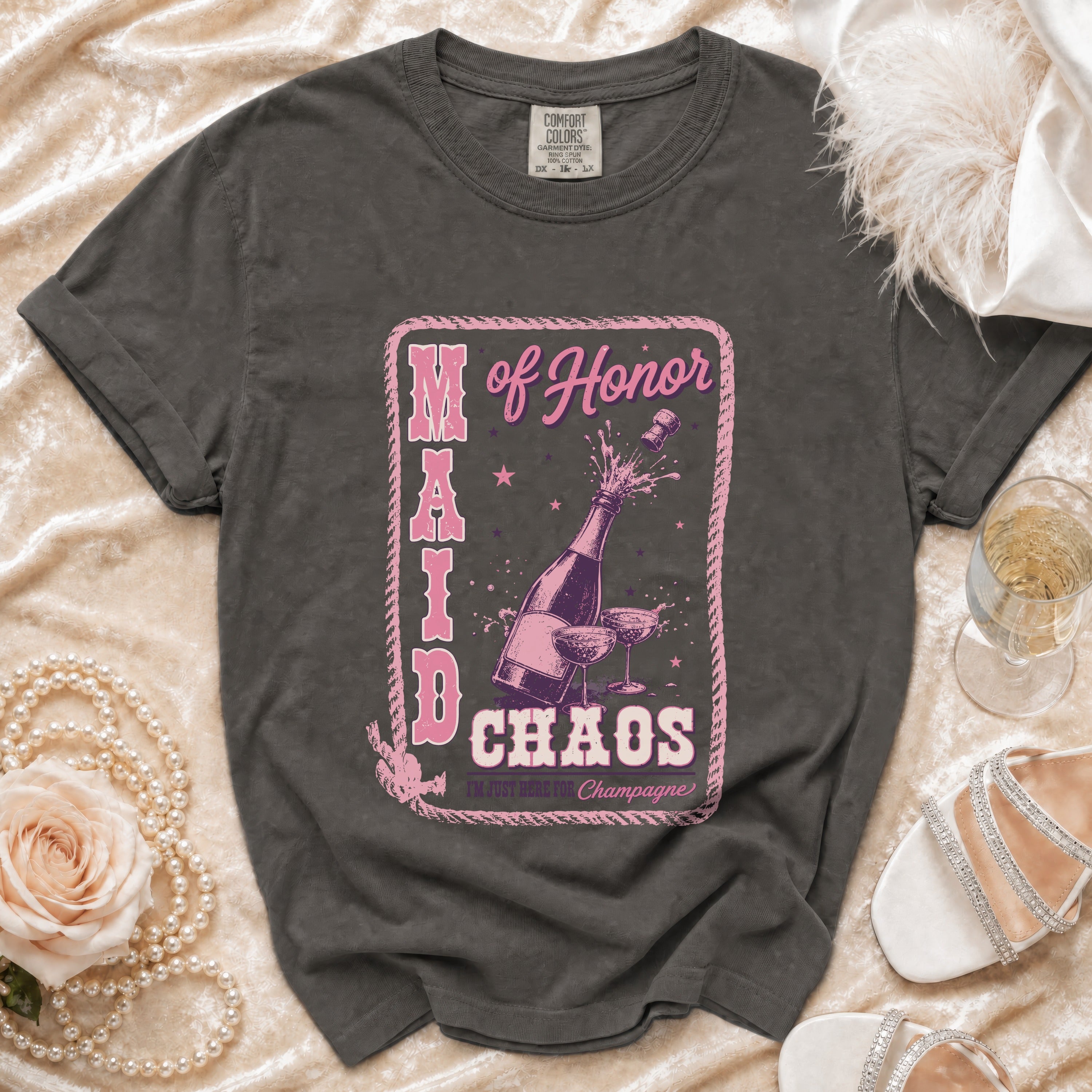 Dark grey t-shirt with "Maid of Honor Chaos I'm Just Here for Champagne" graphic.