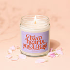 Candle with lavender label reading "Two hearts, one U-Haul".
