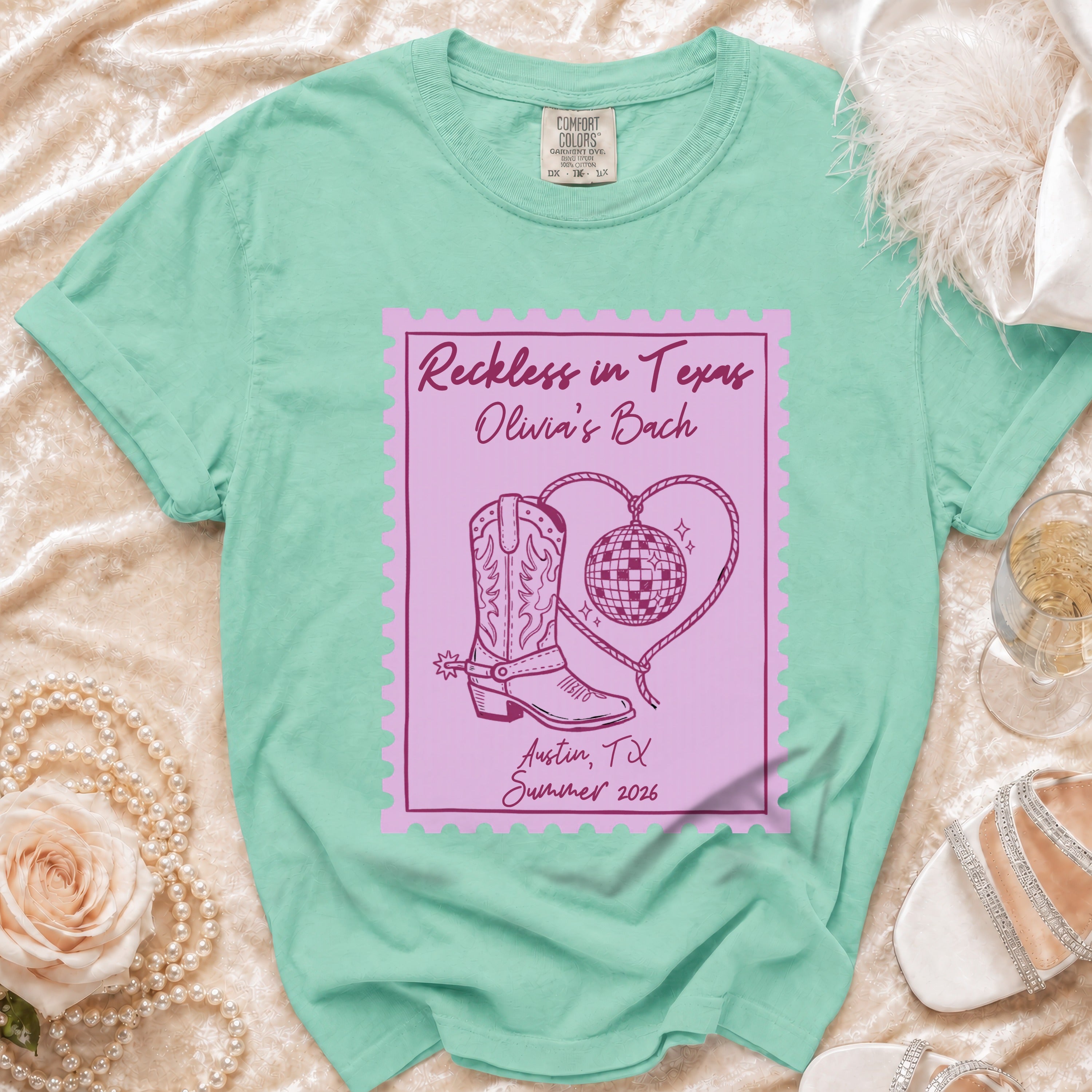 Mint green t-shirt with "Reckless in Texas Olivia's Bach" design.