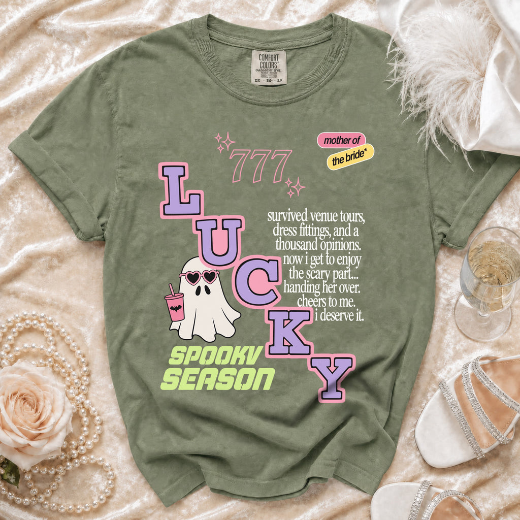 Green t-shirt with "LUCKY GHOST SPOOKY SEASON" text and "mother of the bride" accent.