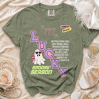 Green t-shirt with "LUCKY GHOST SPOOKY SEASON" text and "mother of the bride" accent.