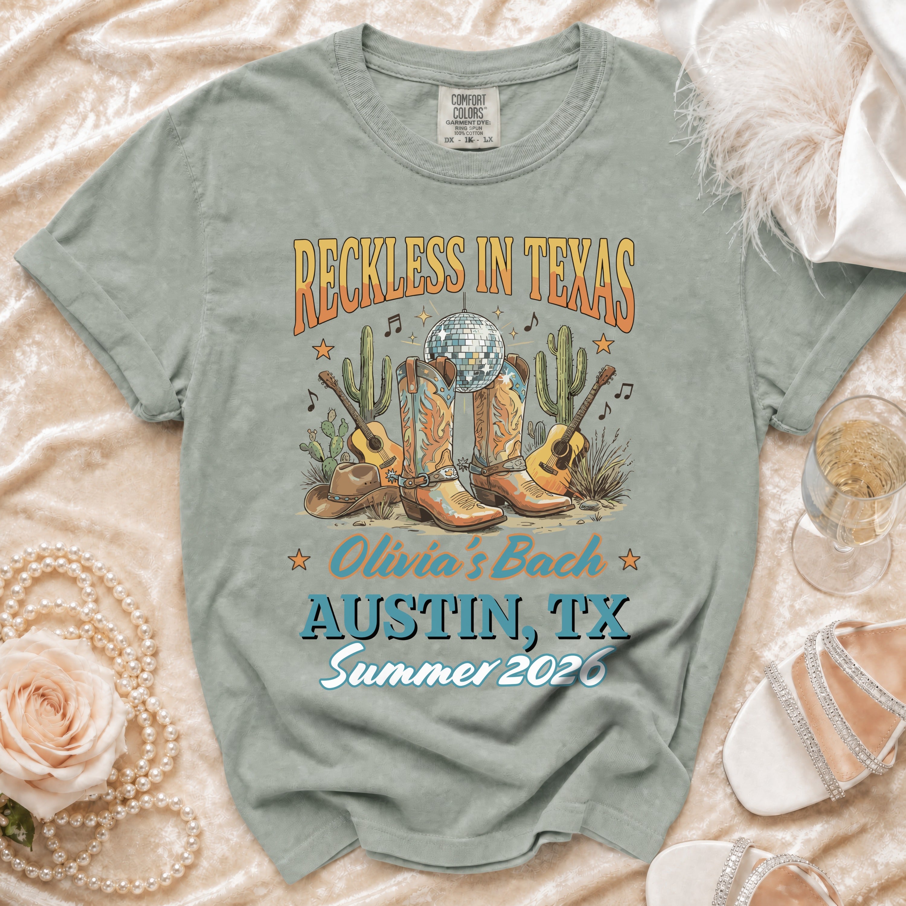 Reckless in Texas t-shirt with cowboy boots, disco ball, and "Olivia's Bach Austin, TX Summer 2026".