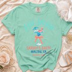 Mint green t-shirt with "Last Splash" and flamingo cocktail graphic.