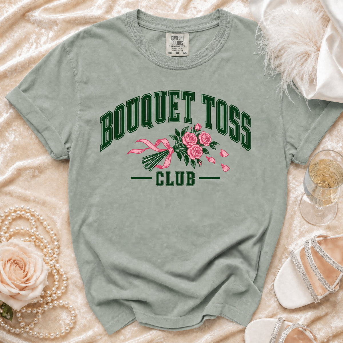 T-shirt with "BOUQUET TOSS CLUB" text and pink roses graphic.