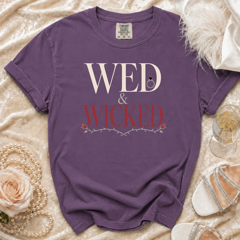 Purple t-shirt with "WED & WICKED" text and a diamond ring graphic.