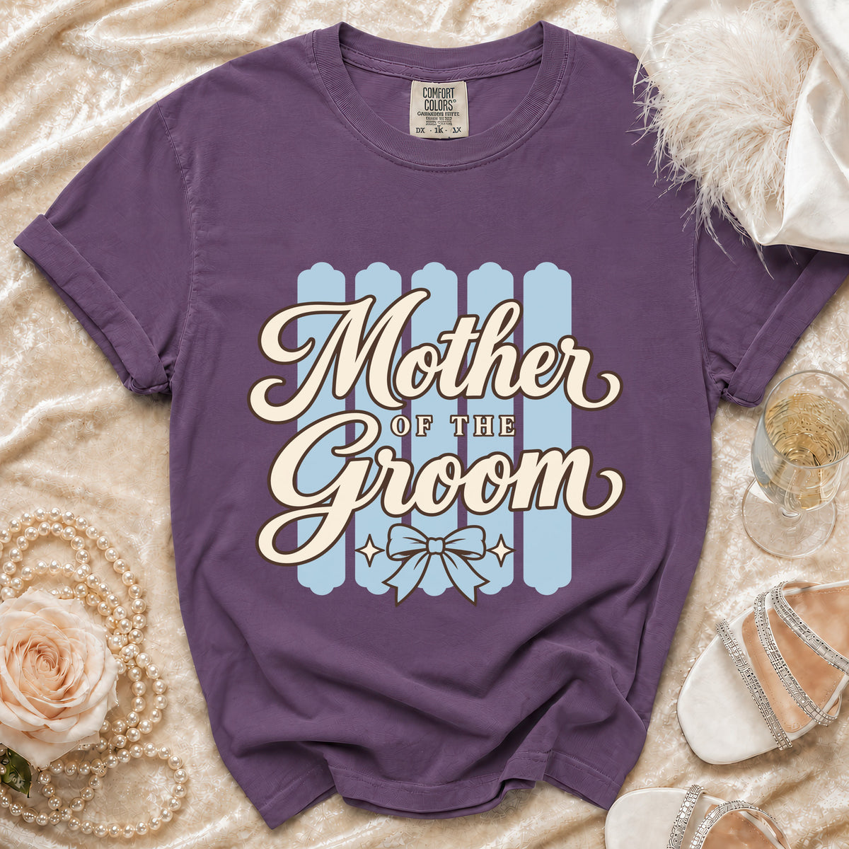Purple t-shirt with "Mother of the Groom" text and a bow graphic.