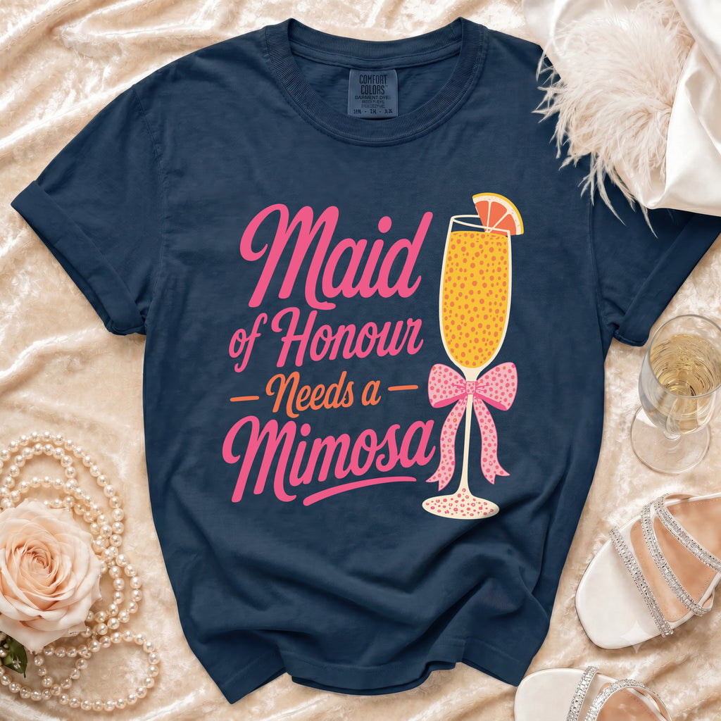 Navy t-shirt with "Maid of Honour Needs a Mimosa" graphic and mimosa cocktail.
