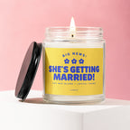 Candle with yellow label reading "BIG NEWS: SHE'S GETTING MARRIED!"