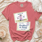 T-shirt with "Austin, TX Summer 2026 Reckless in Texas Olivia's Bach" text and graphics.