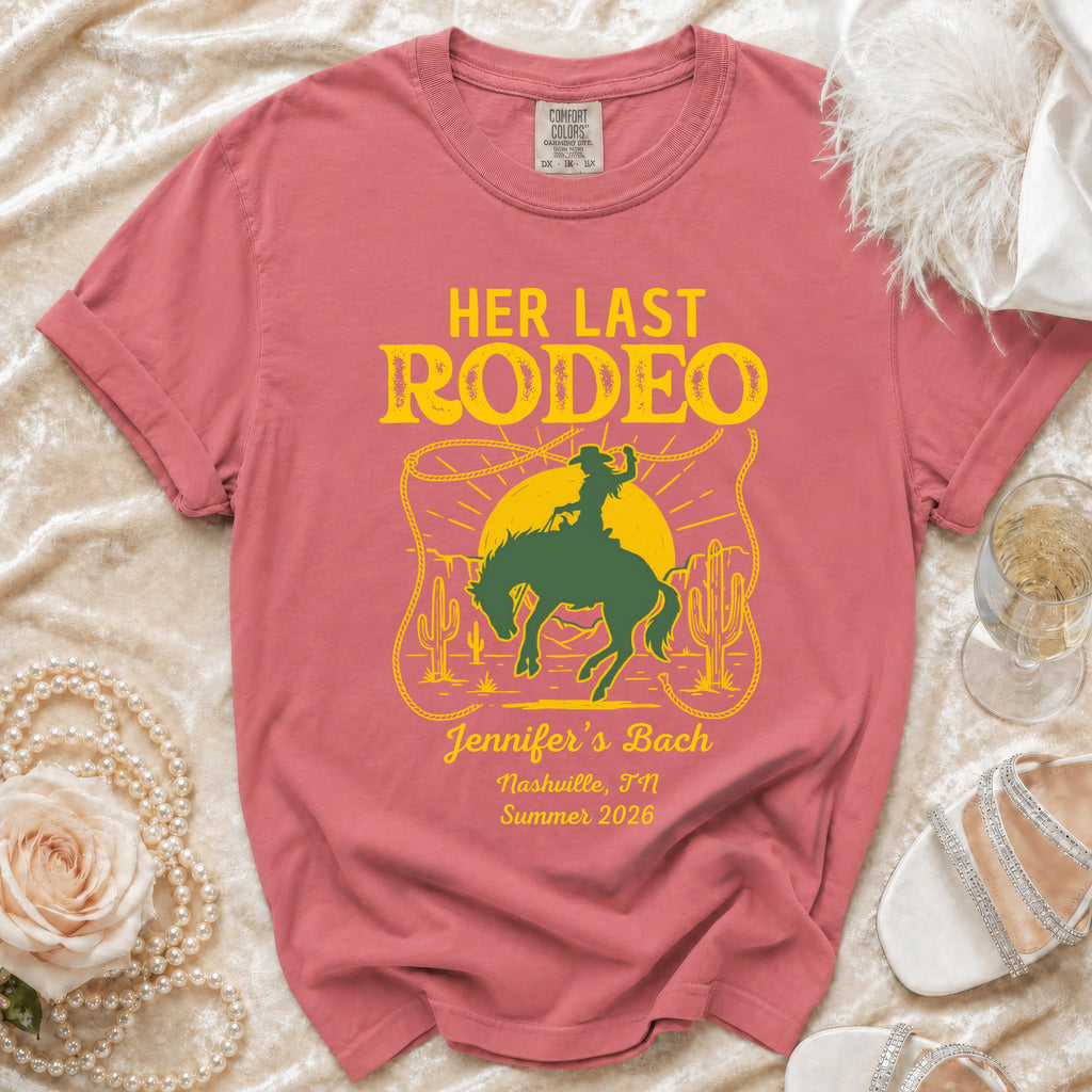 Rose-colored shirt with "Her Last Rodeo" graphic for Jennifer's Bach.