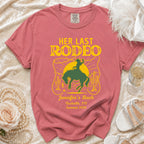 Rose-colored shirt with "Her Last Rodeo" graphic for Jennifer's Bach.