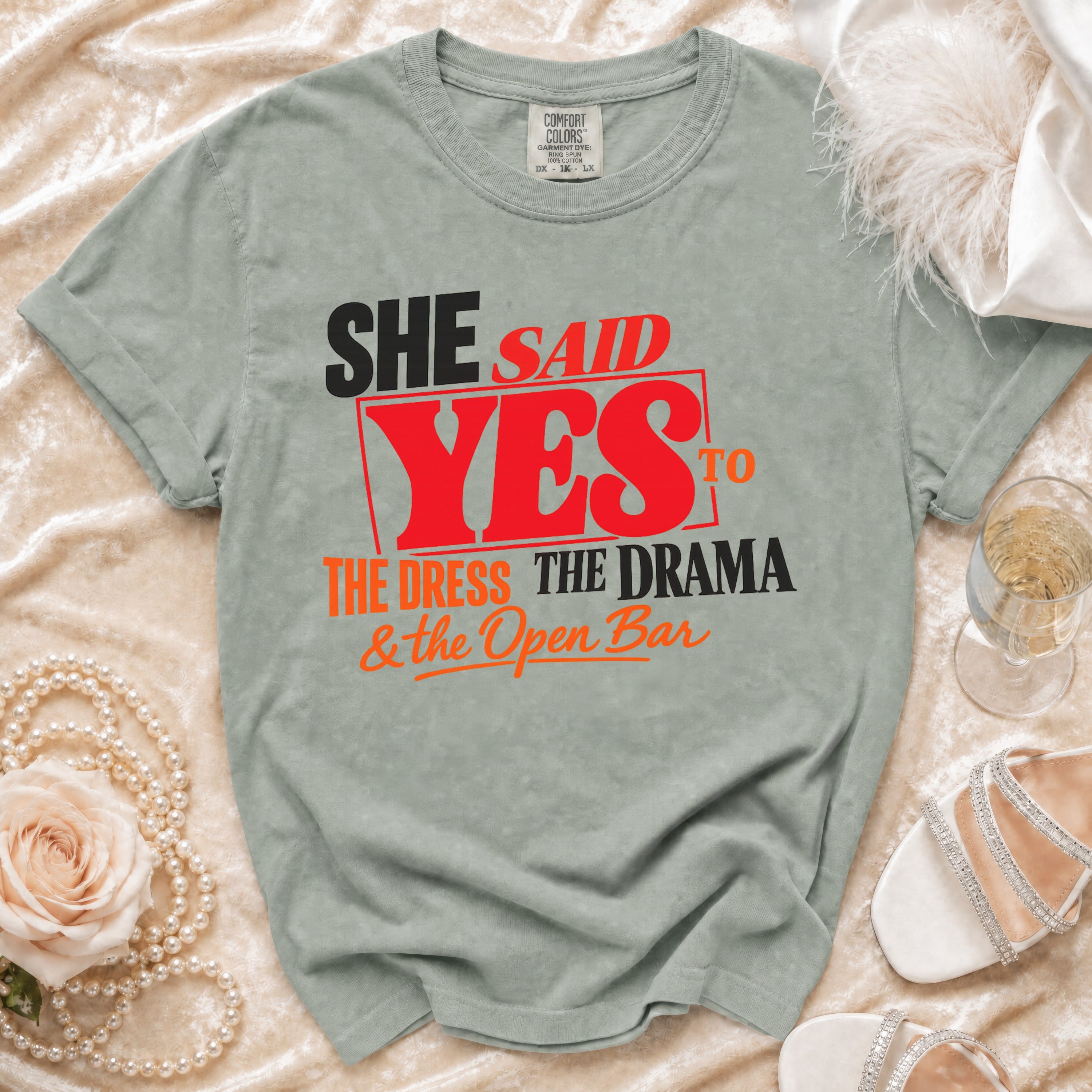 Light green t-shirt reading "She Said Yes to The Dress, The Drama & the Open Bar."