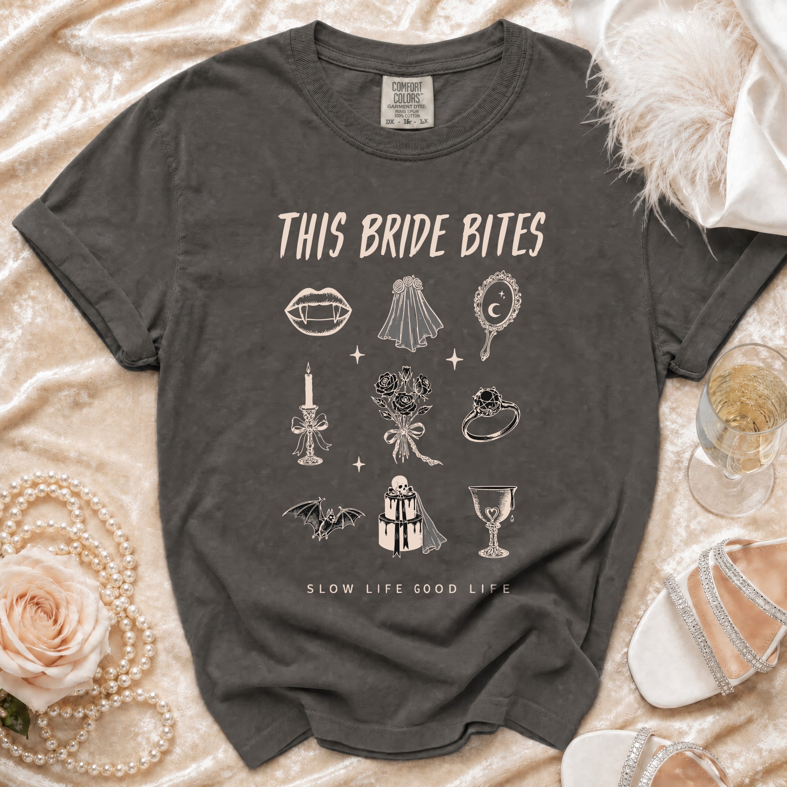 Dark grey t-shirt with "This Bride Bites" and gothic bridal illustrations.