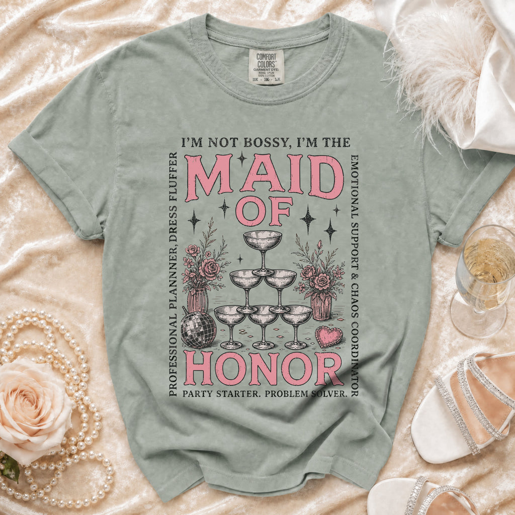 Maid of Honor t-shirt with quote and champagne glasses graphic.