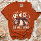 Orange t-shirt with "Mother of the Groom Spooked But Still Booked" graphic.