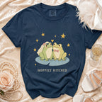 Navy t-shirt with wedding frogs graphic and "Hoppily Hitched" text.