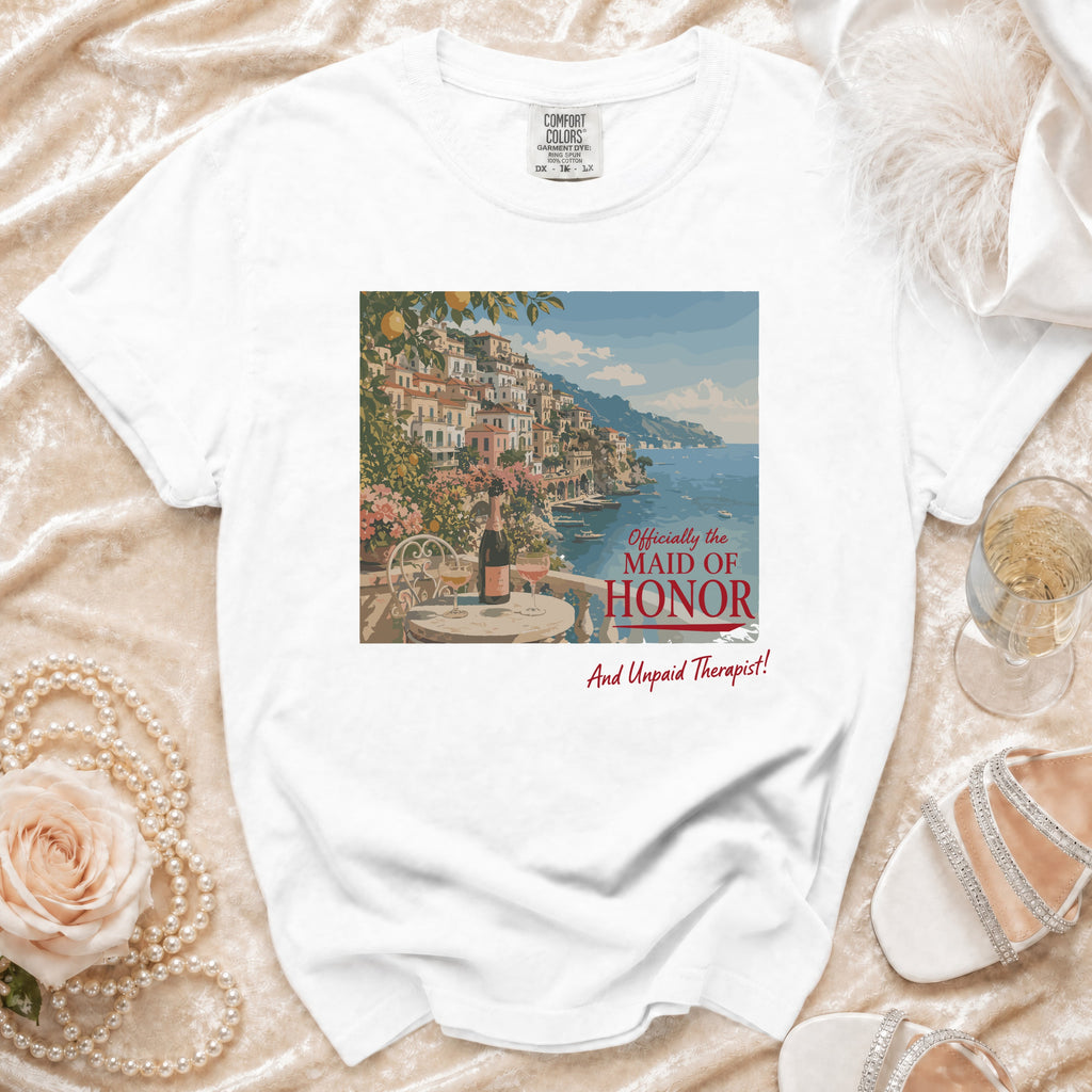 White t-shirt with print of Amalfi Coast town, champagne, and text.