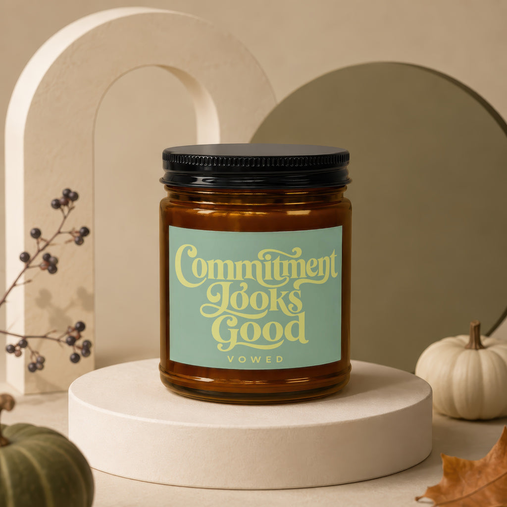 Amber jar candle with a light green label reading "Commitment Looks Good" and "vowed."