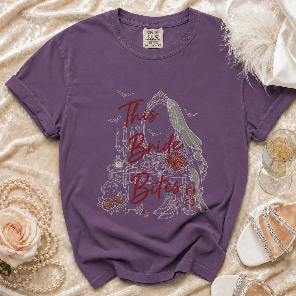 Purple t-shirt with "This Bride Bites" gothic design and vampire bats.