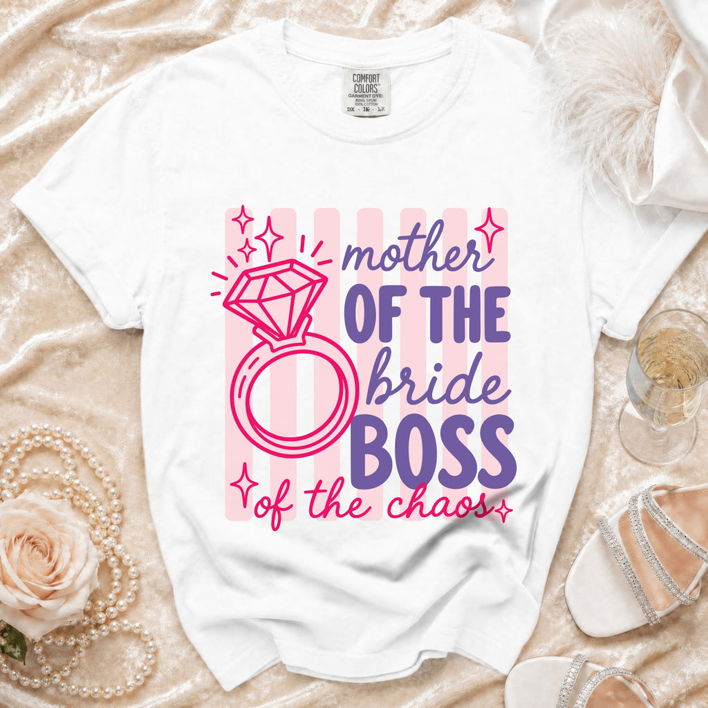 White t-shirt graphic with "mother of the bride boss of the chaos" text.