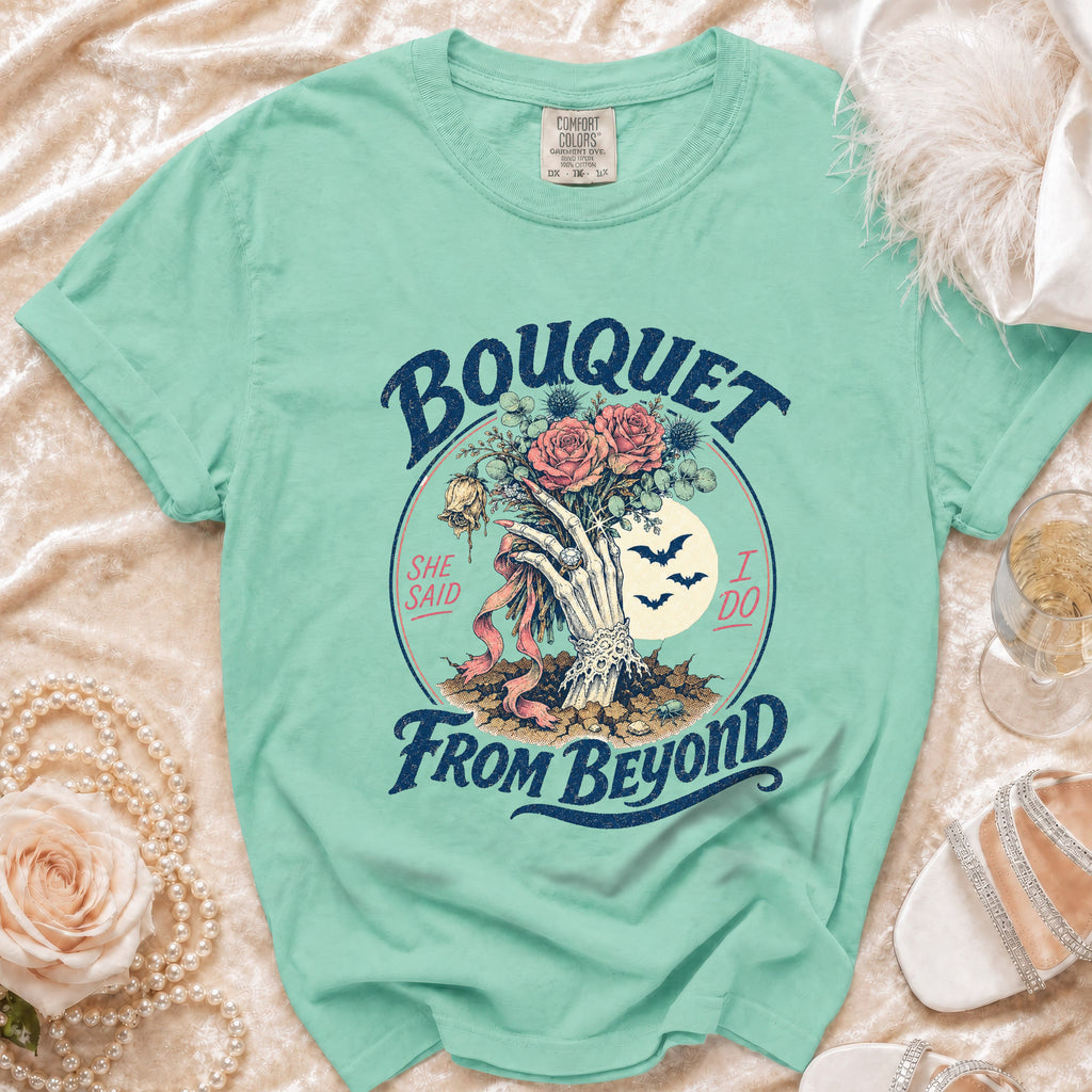 Mint green t-shirt with skeleton hand holding Bouquet From Beyond text.