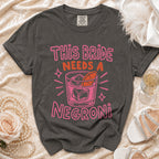 T-shirt with "This Bride Needs A Negroni" text and cocktail graphic.