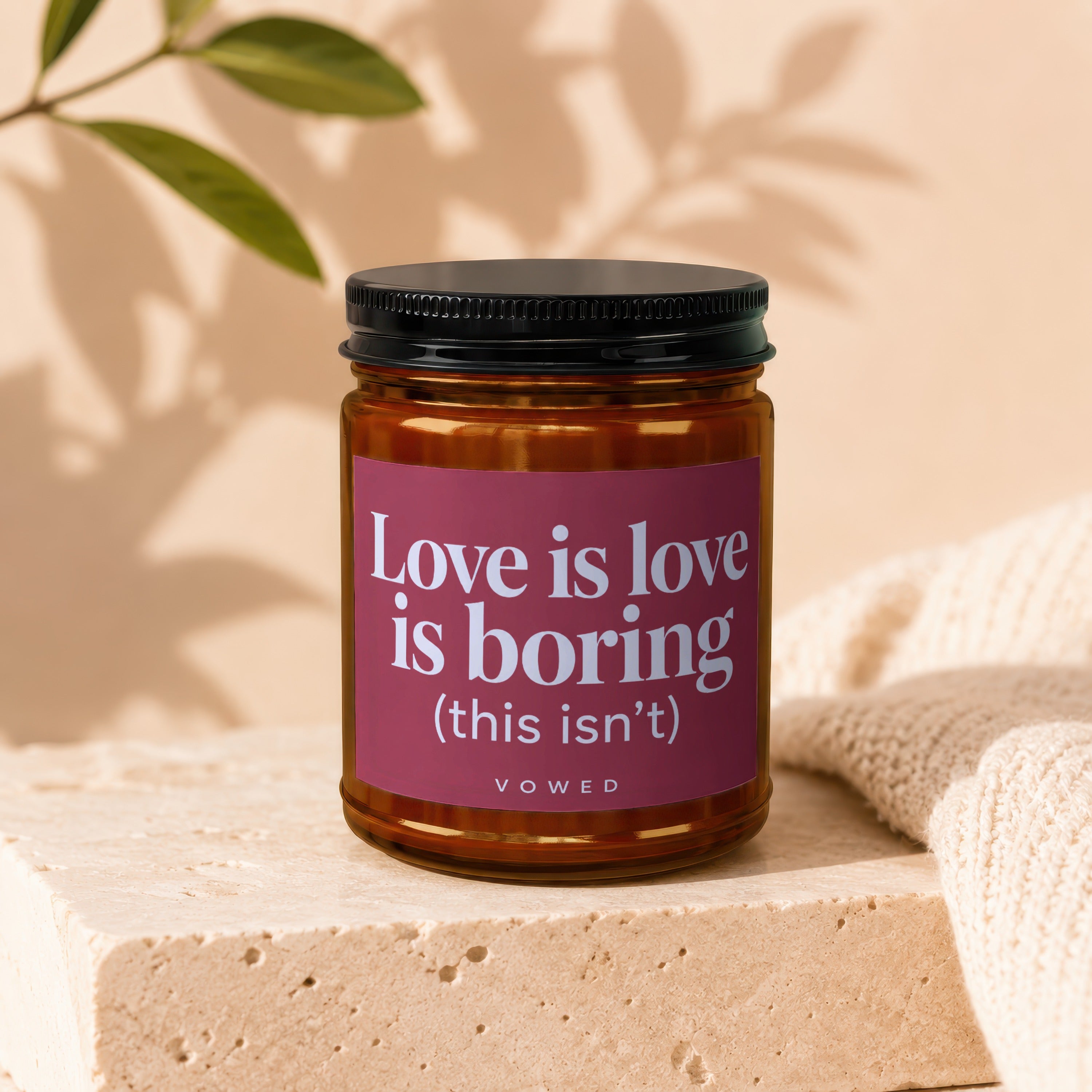 Vowed candle with text "Love is love is boring (this isn't)".