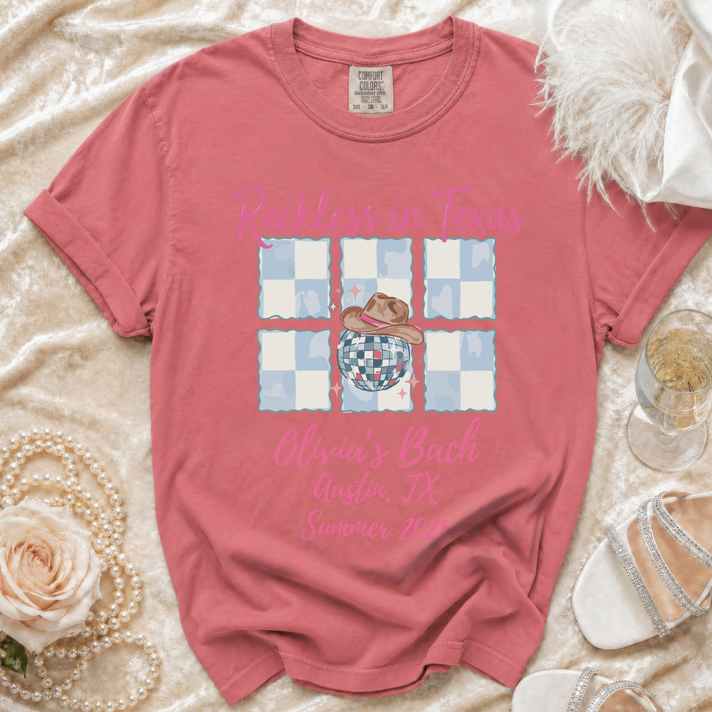 Pink t-shirt with "Reckless in Texas" and bachelorette party details.
