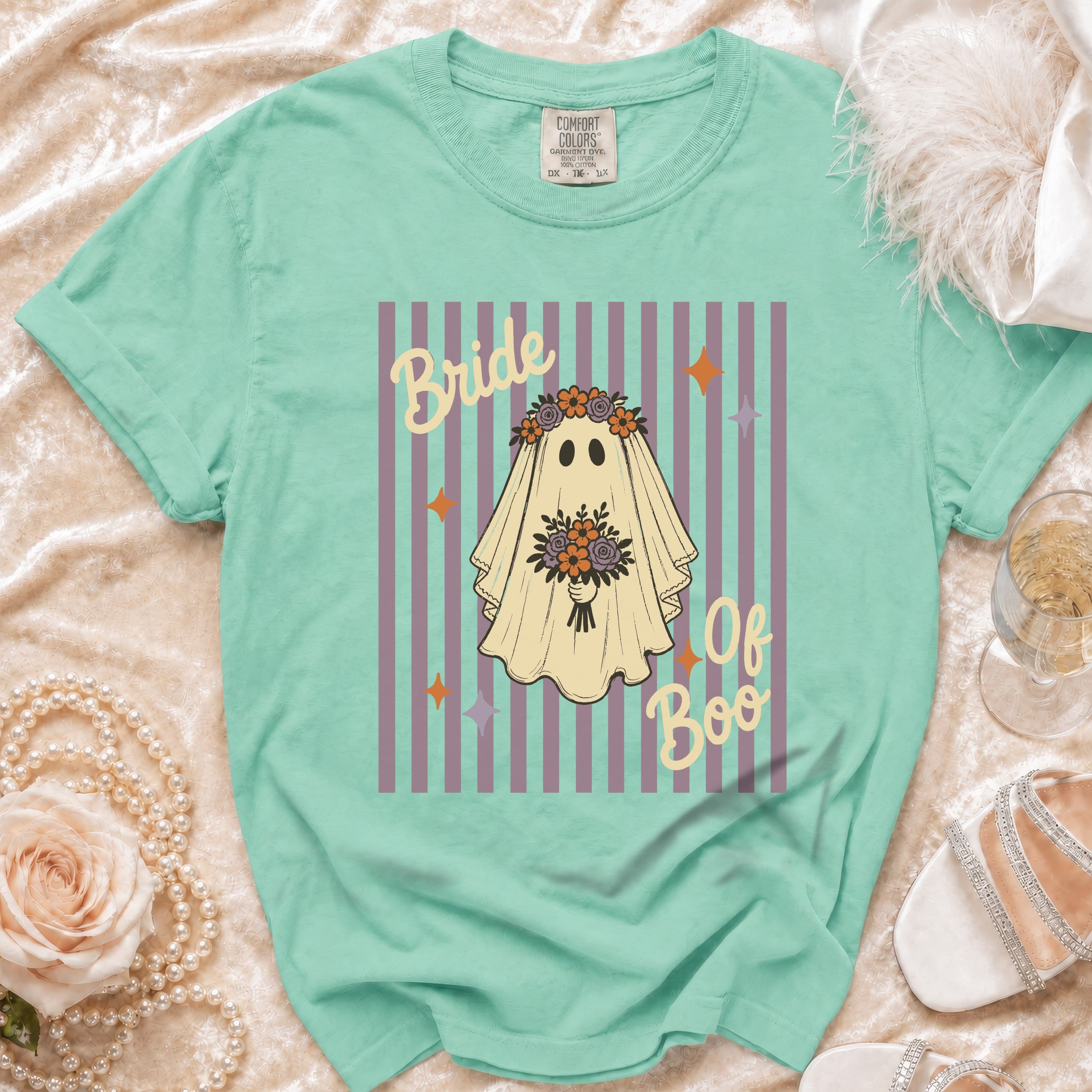 Mint t-shirt with a graphic of a ghost in a floral veil saying "Bride of Boo."