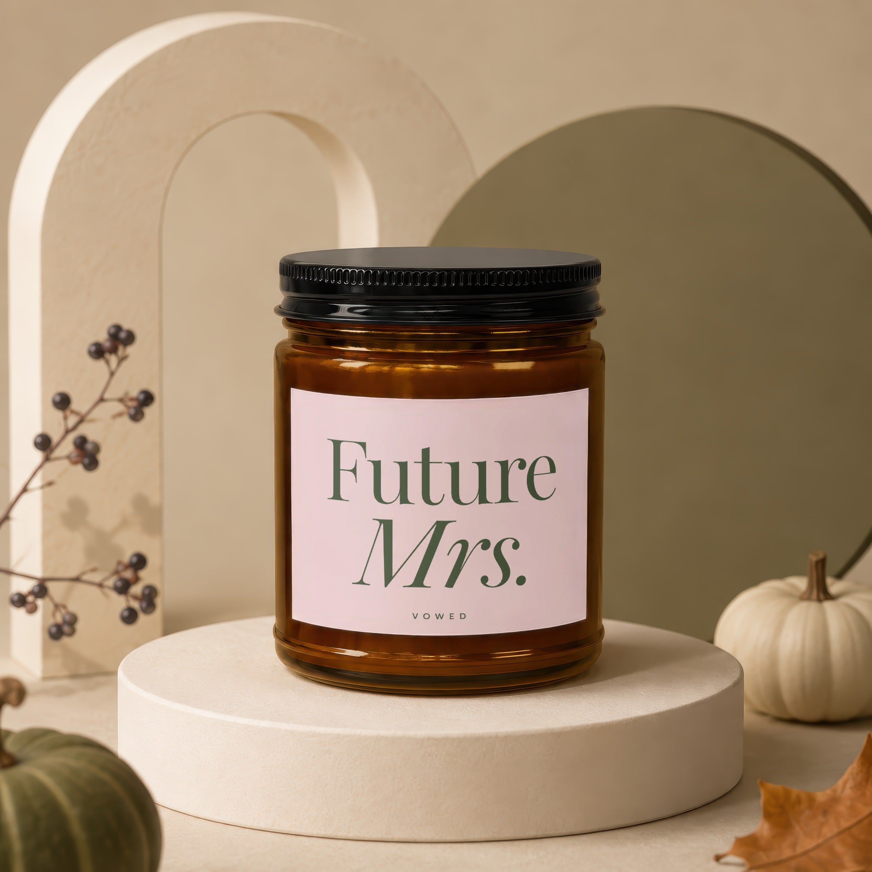 Candle labeled "Future Mrs." with the word "vowed" below, on a pedestal.
