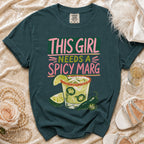 Teal t-shirt with "This Girl Needs a Spicy Marg" text and spicy margarita graphic.