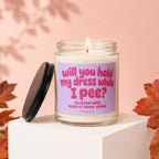 Candle labeled "Will you hold my dress while I pee? Scented with maid of honor duties."