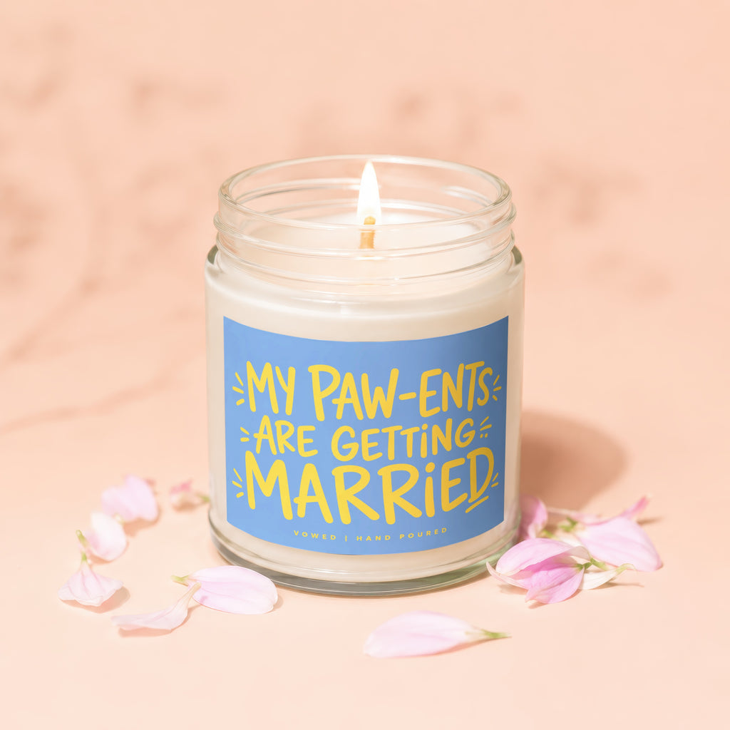 Jar candle with blue label saying "MY PAW-ENTS ARE GETTING MARRIED".