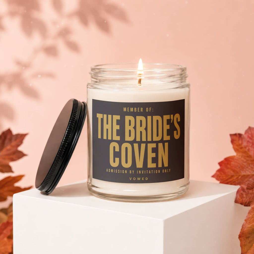 Glass candle with label reading "MEMBER OF: THE BRIDE'S COVEN".