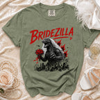 T-shirt with Bridezilla graphic featuring Godzilla in wedding veil holding flowers over a city.
