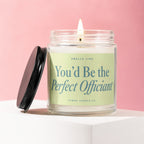Candle with lid off, displaying text "You'd Be the Perfect Officiant".