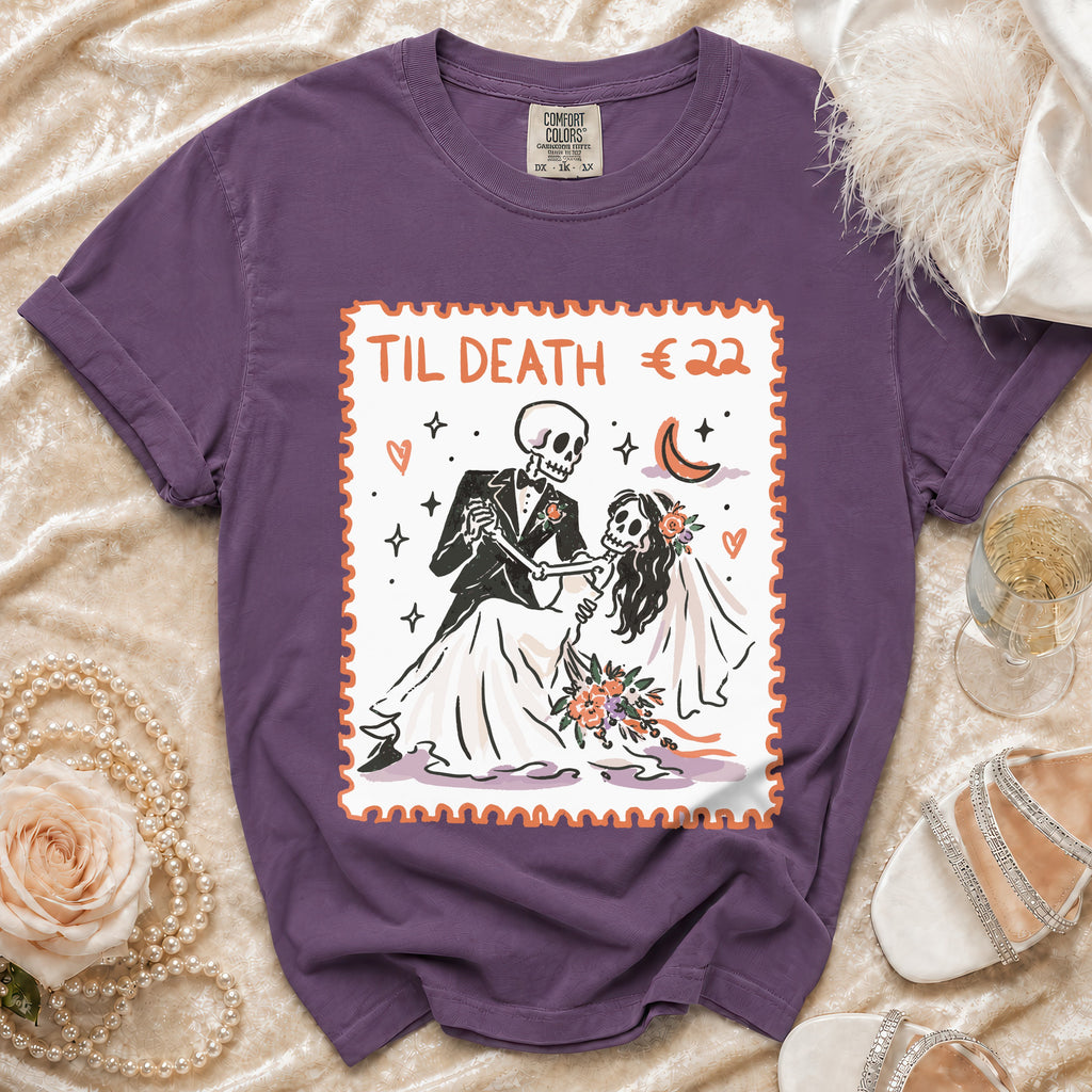 Purple t-shirt with skeleton bride and groom graphic saying "TIL DEATH €22".