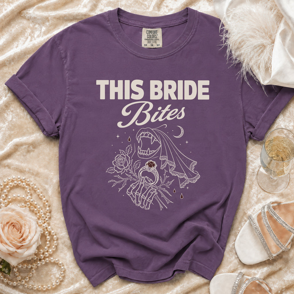 Purple t-shirt with "THIS BRIDE Bites" text and vampire-themed graphic.