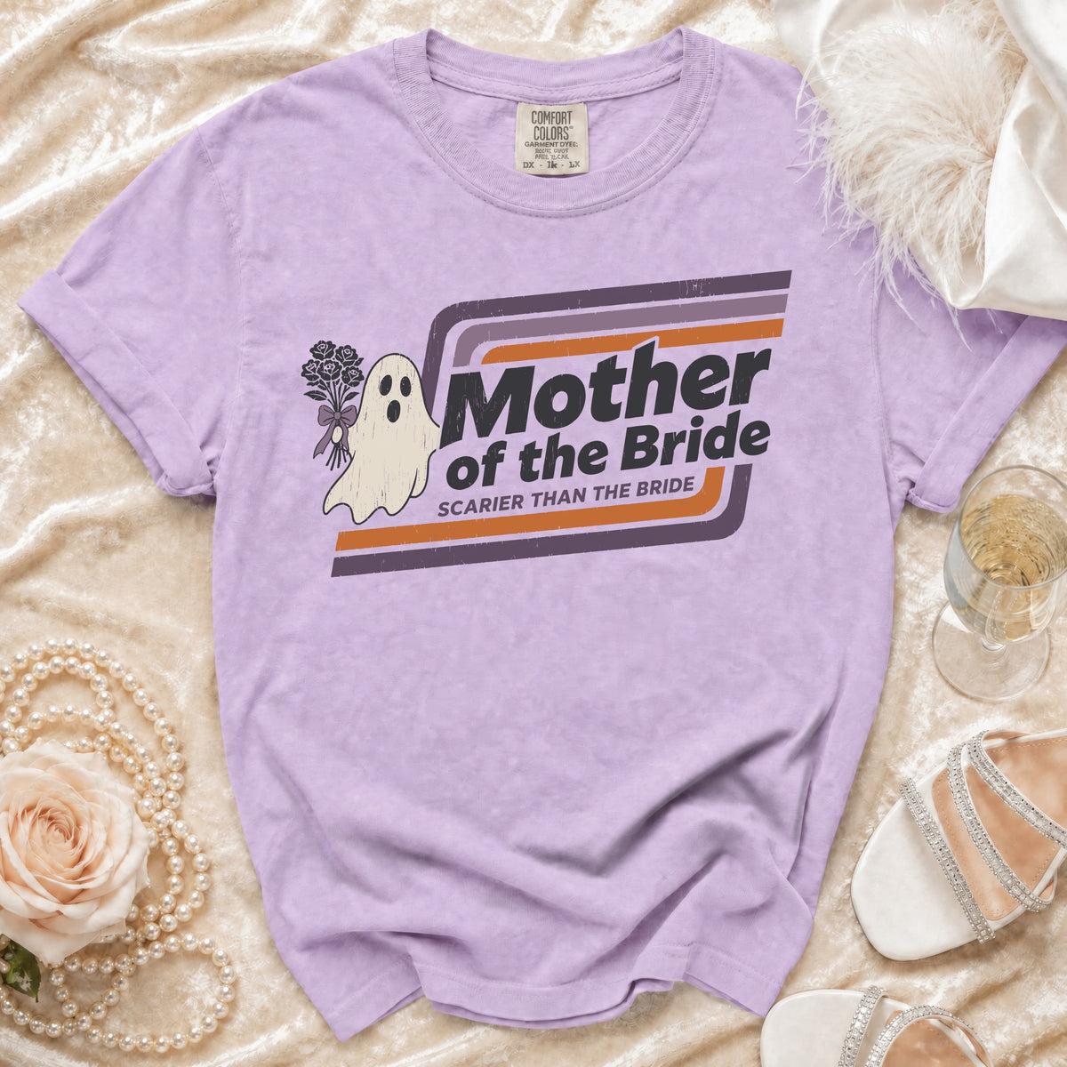 Purple t-shirt with ghost holding flowers, says "Mother of the Bride Scarier Than The Bride".
