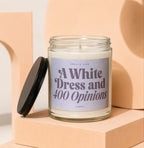 Glass candle with label reading "Smells Like A White Dress and 400 Opinions".