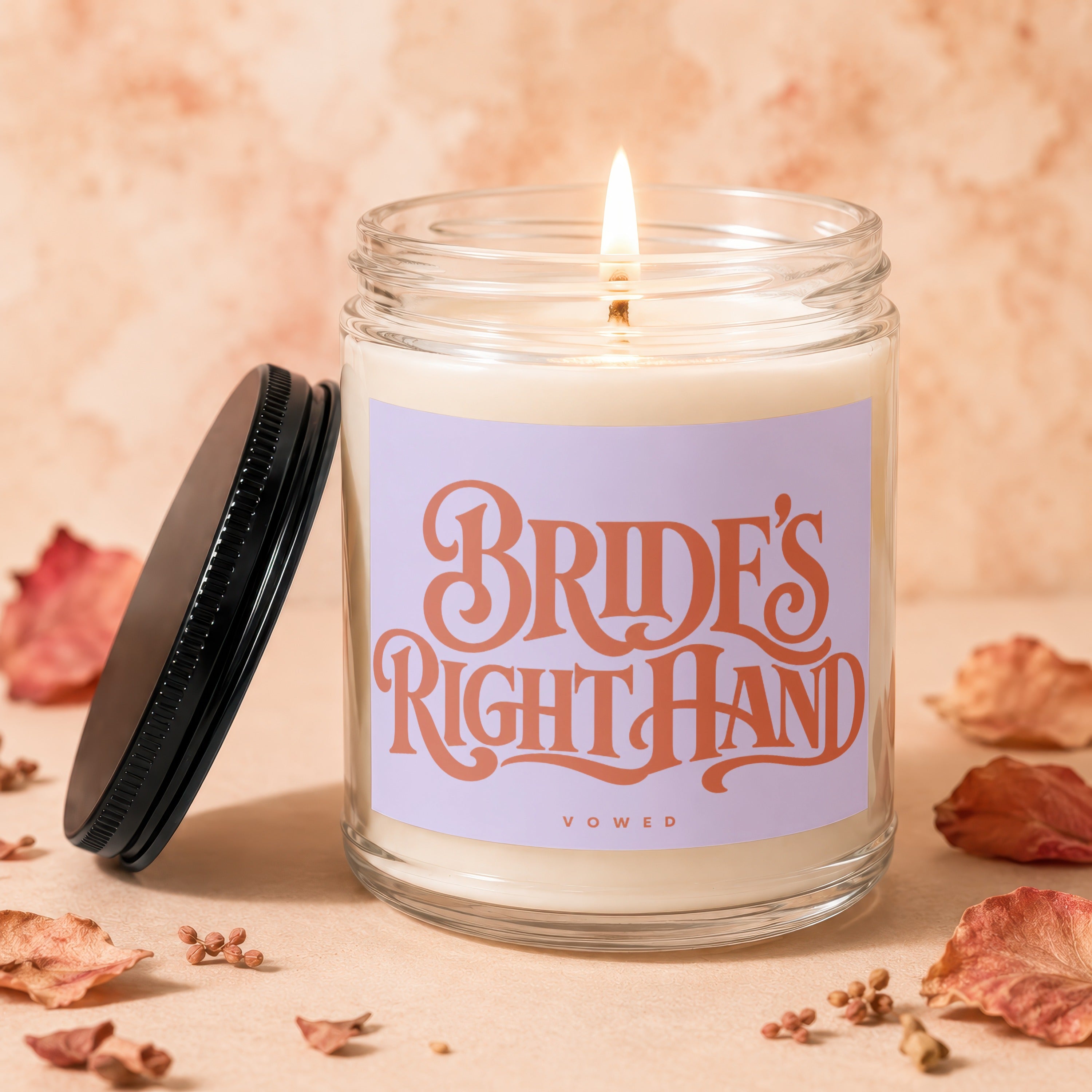 Burning candle with "Bride's Right Hand" text on label, lid nearby.